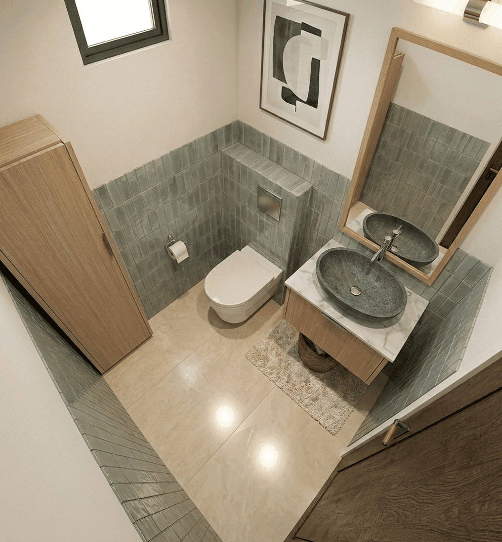 Vue d'ensemble des WC avec carrelage vert et vasque en pierre